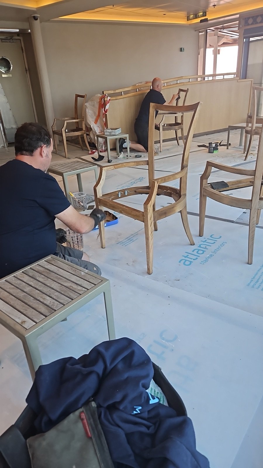 The Nauticare Solutions team at work refinishing furniture