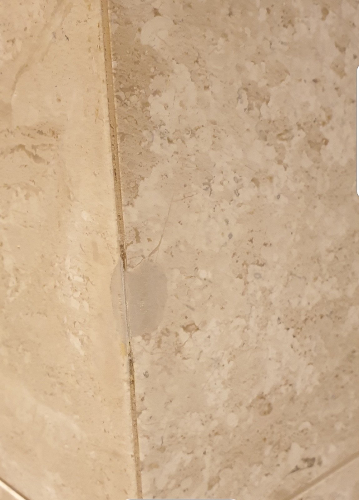 Marble corner crack repair — before